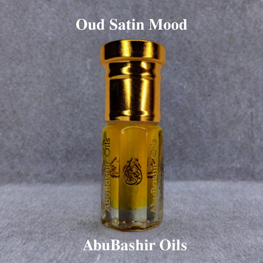 Oud Satin Mood fragrance oil by AbuBashir Oils with amber, citrus, floral, and oud notes in a gold-capped glass bottle