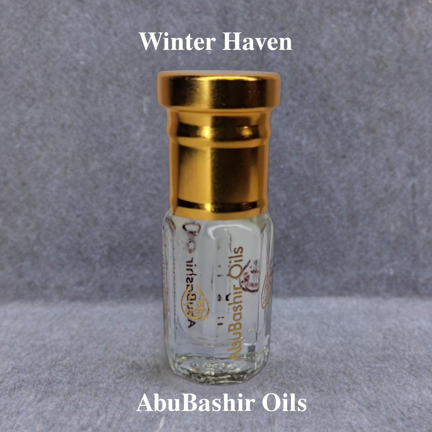Winter Haven fragrance oil bottle by AbuBashir Oils with golden cap on grey background
